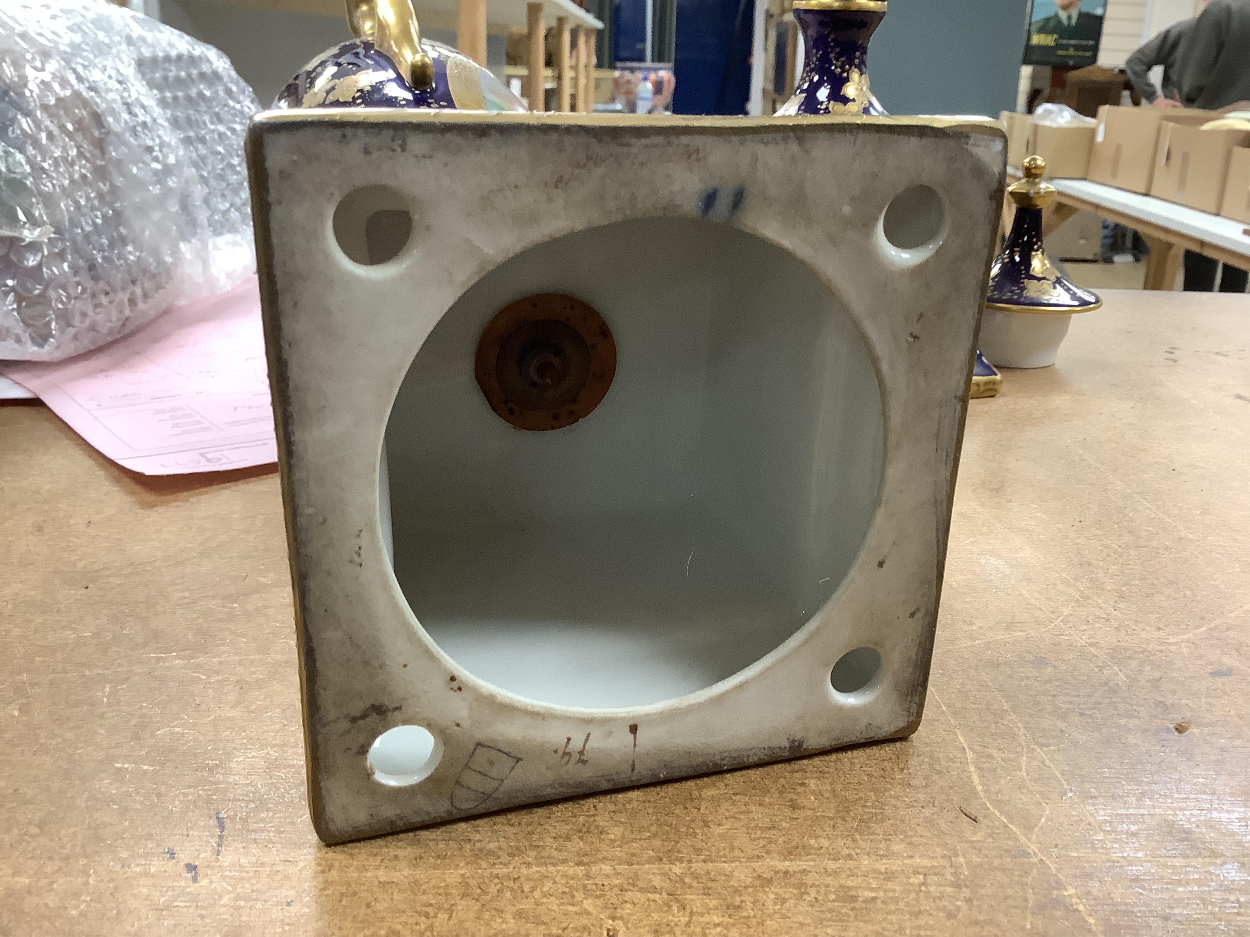 A pair of early 20th century Vienna style porcelain urns and covers, 36cm